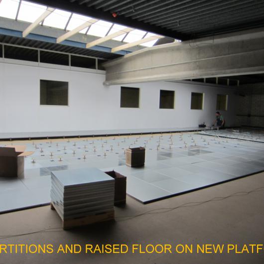 Partitions and raised floor on platform